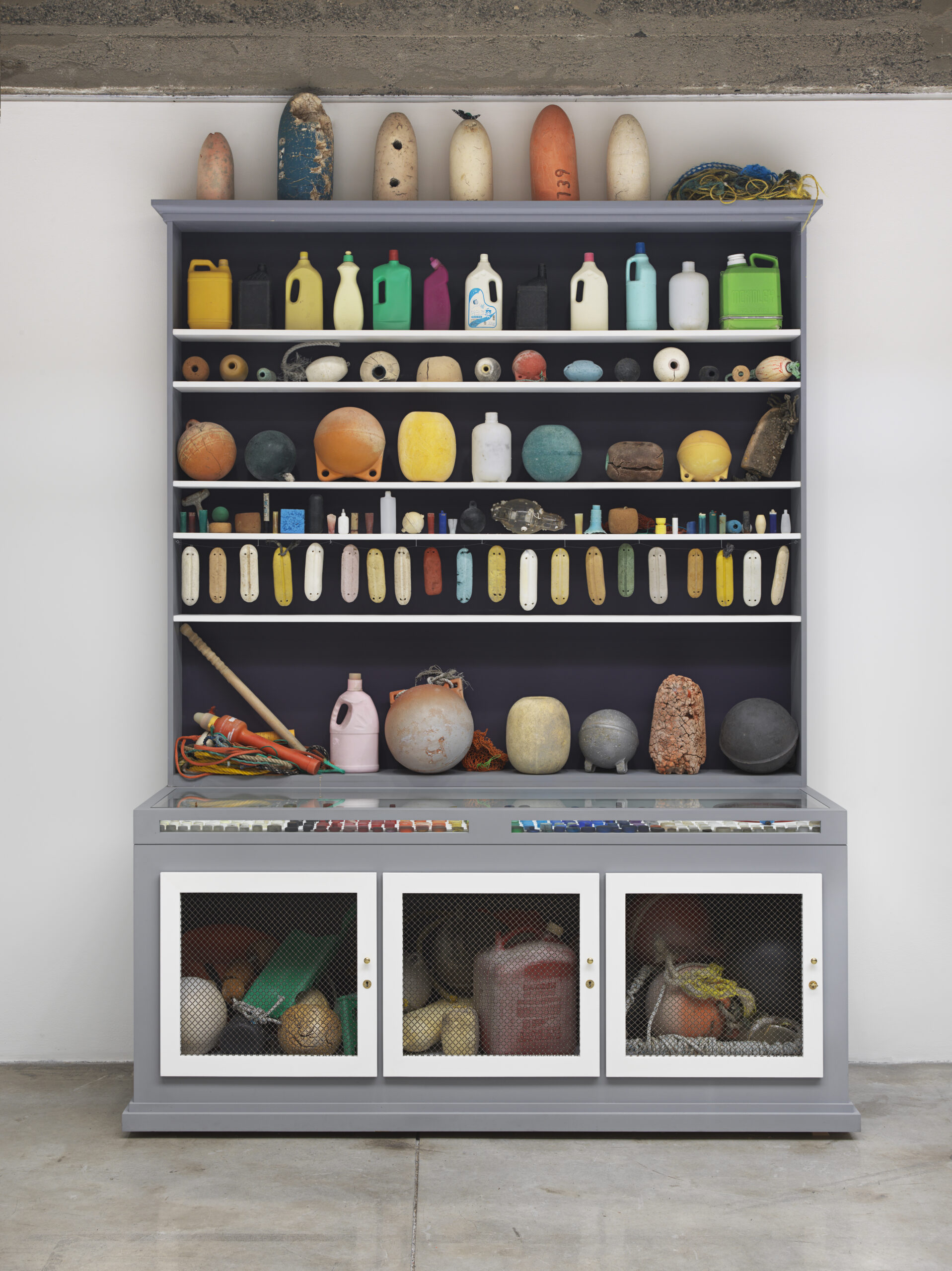 Mark Dion (American, b. 1961), Cabinet of Marine Debris, 2014, wood and metal cabinet, marine debris, plastic, rope 113 x 84 x 32 inches. Margulies Collection, Miami Courtesy American Federation of Arts