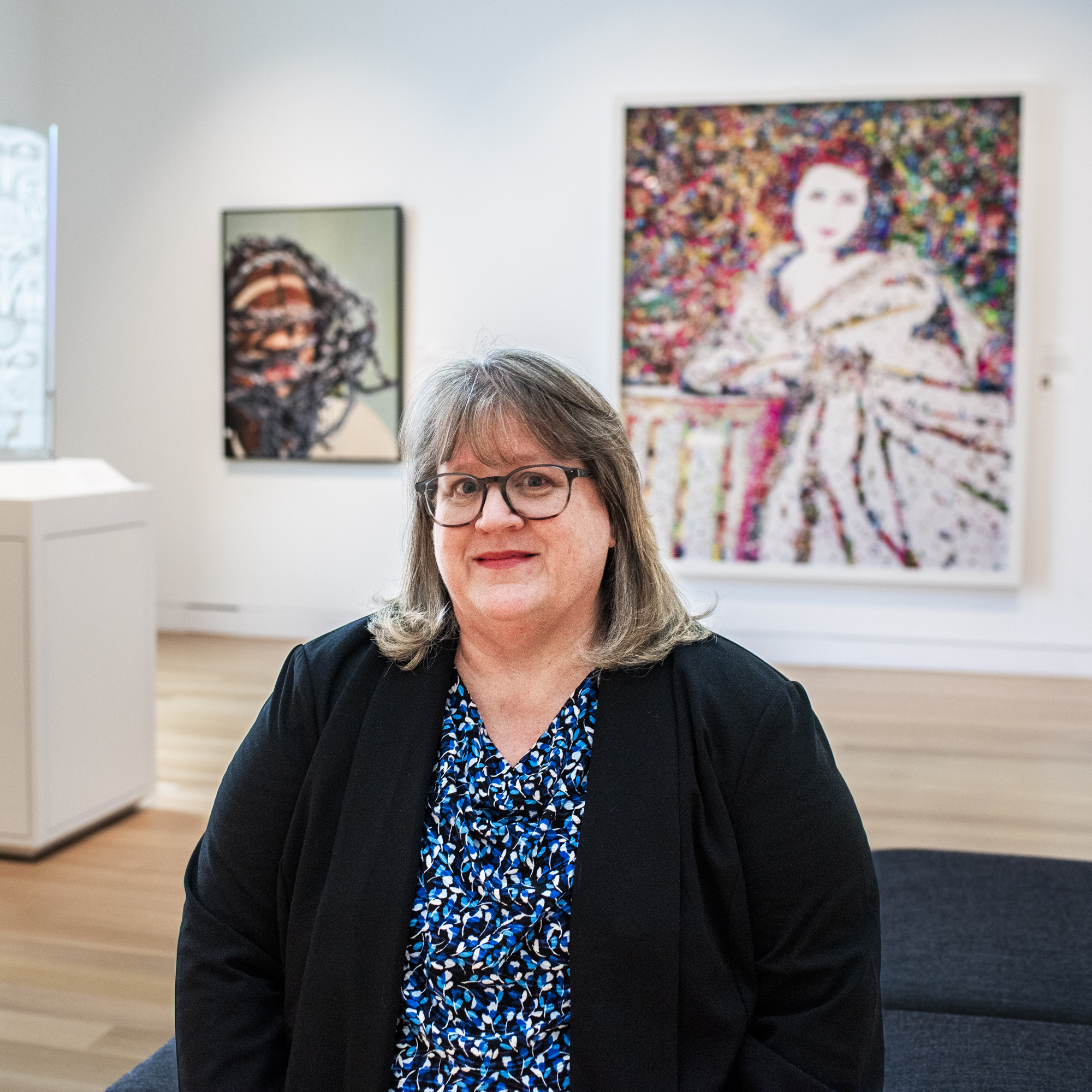 Woman sitting in an art gallery